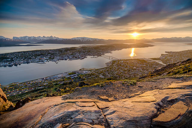 tromso city in tromsoya island seen from mount storsteinen under the midnight sun, norway