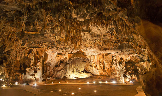 lights lit up in the throne room in cango caves in oudtshoorn, south africa