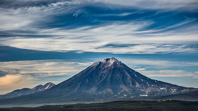 dramatic clous on the background of kamchatka volcano in russia