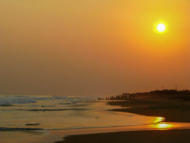golden light of sunset falls on chandrabhaga beach near puri, odisha