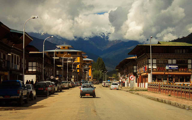 cars parked at the side of a road in phuentsholing bhutan