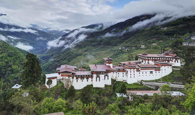 trongsa dzong betweeen clouds from a viewpoint