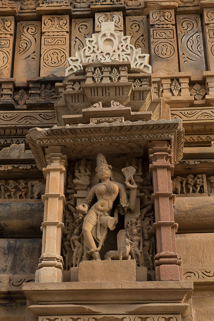 statue carved at temple wall at Khajuraho India