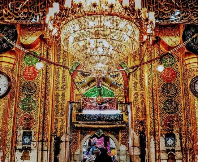 a bright chandelier being lit up amidst beautiful interior inside a mosque in Ajmer Rajasthan India