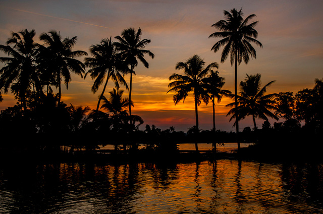 golden sky across backwaters in Alappuzha Kerala India