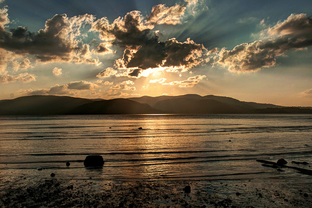 sunrays tearing through the clouds viewed from a beach in Andaman Nicobar islands India