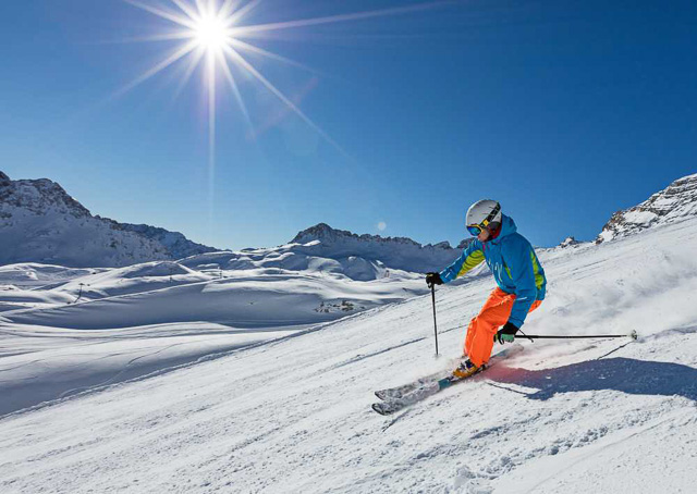 skier slides down while skiing in auli uttarakhand india