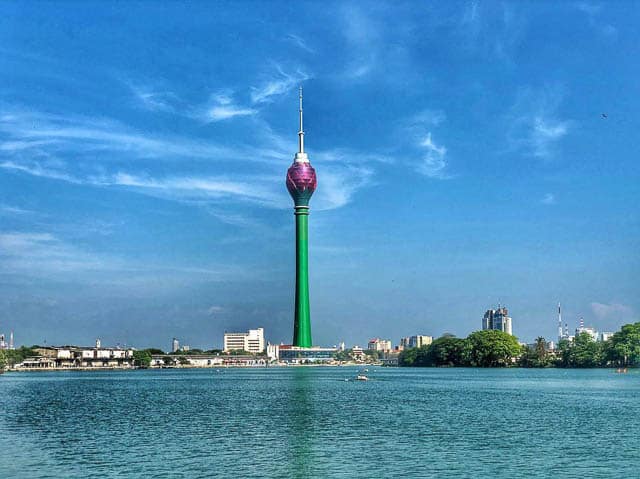 view of lotus tower across a water body in colombo,sri lanka