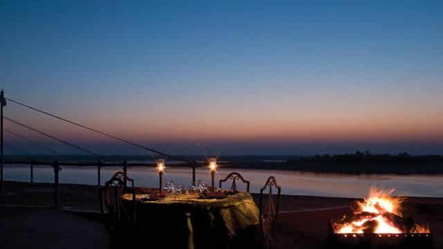 candle light dinner by bonfire in chhatra sagar camps in pali area, rajasthan