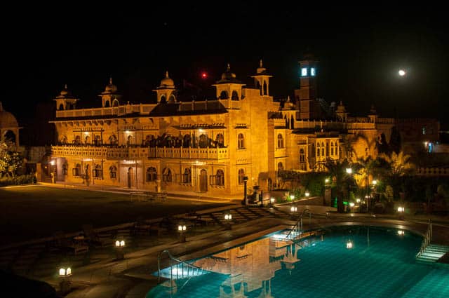 spectacular night lighting by pool in khimsar fort, rajasthan